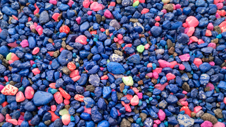 A blend of pink, blue, and black aquarium gravel
