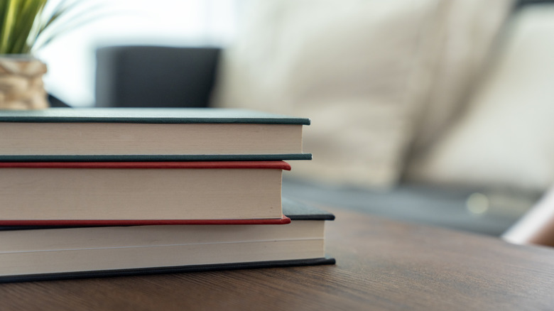 stack of books on coffee table