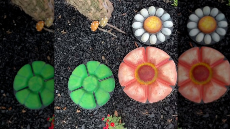 A concrete paver stepping stone in the shape of a flower made from a veggie tray mold