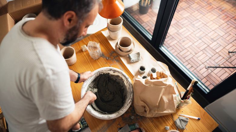 Someone mixing concrete for a DIY