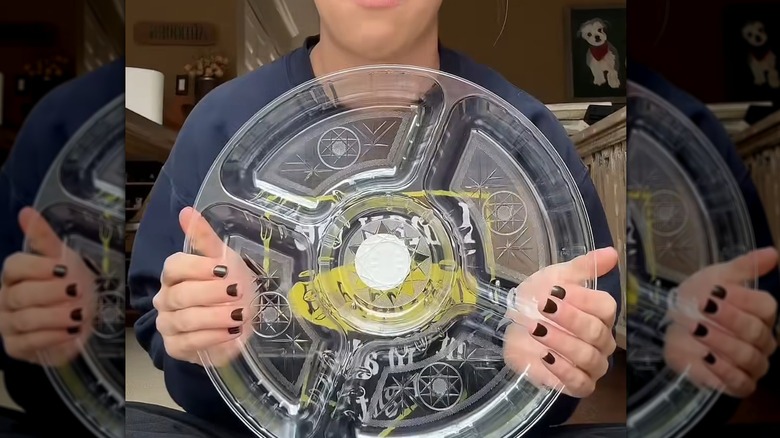A plastic veggie tray from Dollar Tree makes a great mold for a stepping stone