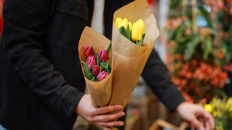 someone picking out bouquets of tulips
