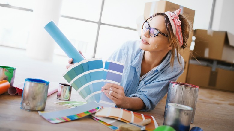 Person looking at paint samples