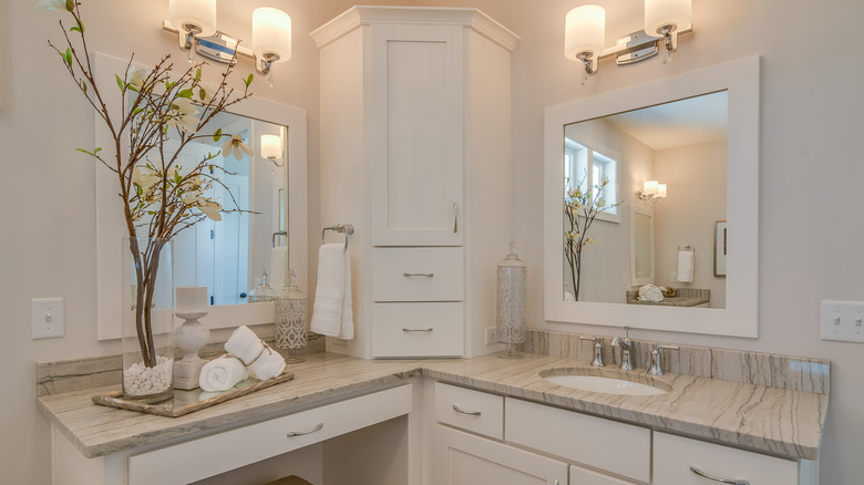 White bathroom with closed cabinet