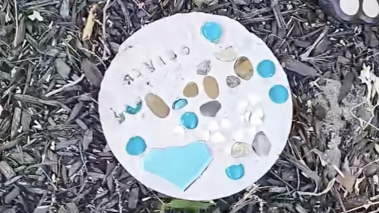 DIY paver with rocks and broken tile pieces