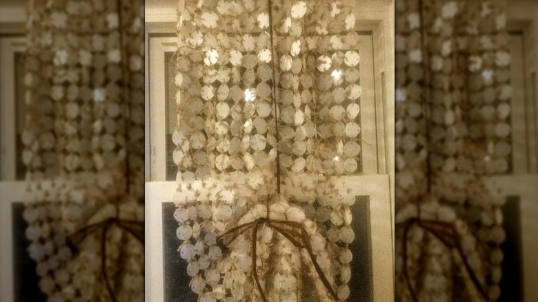 A capiz-style curtain is made from pieces of upcycled milk jugs.