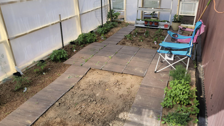 Old roof tiles used to make paths in a utility area of the garden