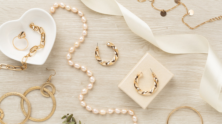 Gold jewelry on a tabletop.