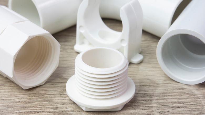 White PVC pipe fittings on a table