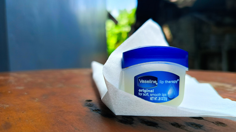 jar of vaseline on a wooden table