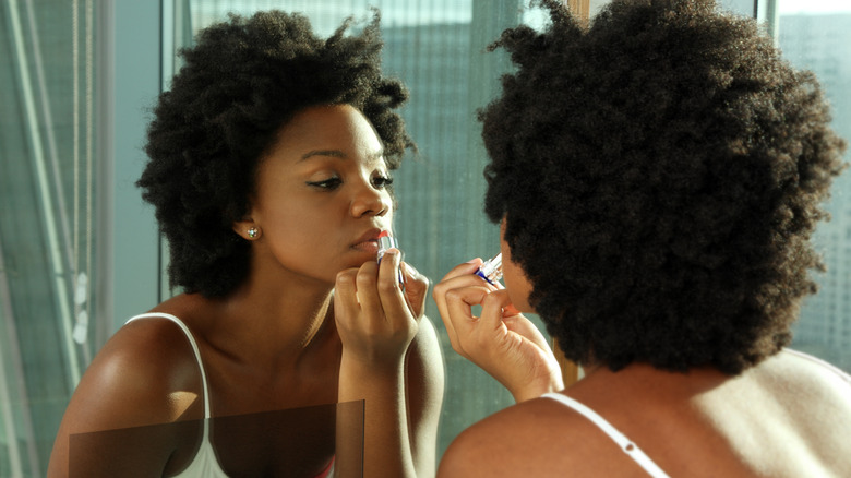 woman getting ready in bathroom