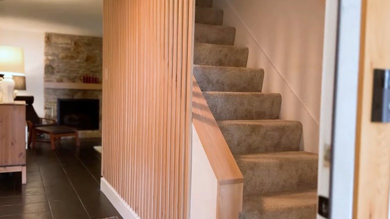 Wood slat stairway wall 
