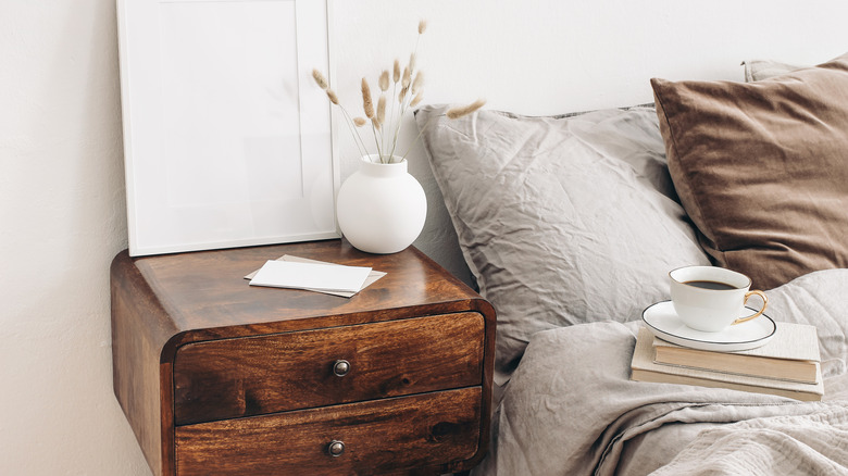 Nightstand next to bed