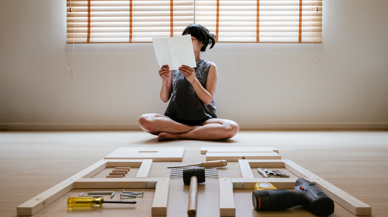 Person reading assembly instructions