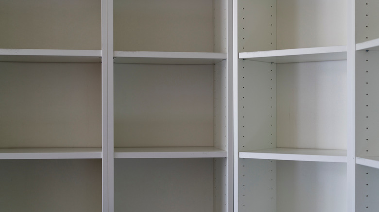 empty white bookshelves