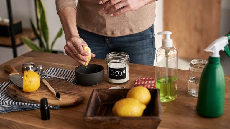 person making cleaner with lemons