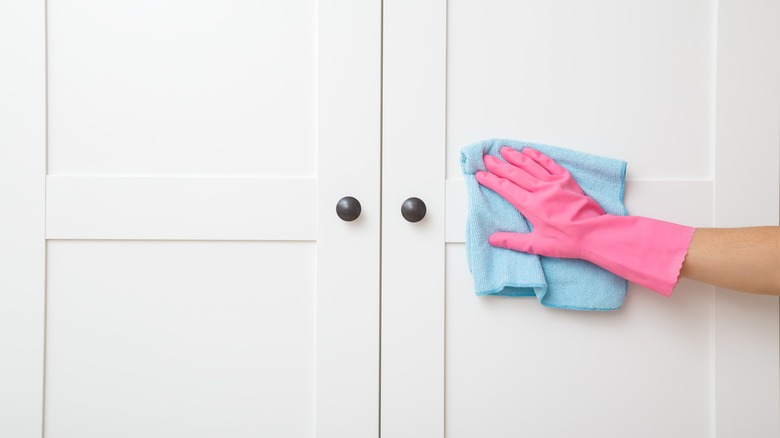 Person cleaning doors