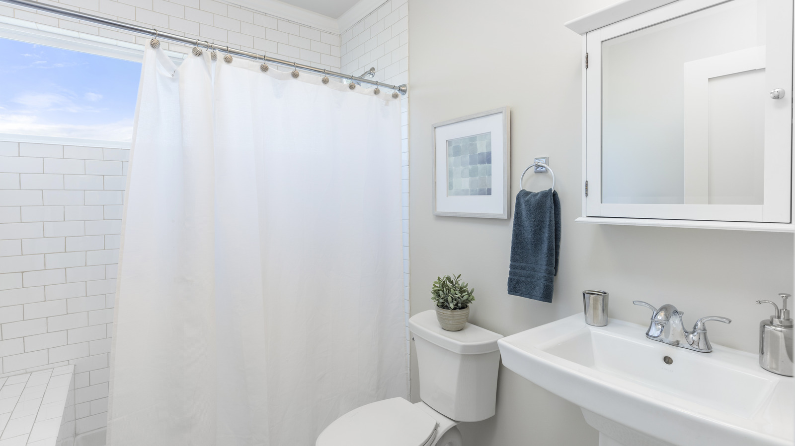 Use This Shower Hack To Keep Your Curtain From Falling Off The Hooks
