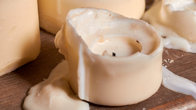 Candle melting off a table