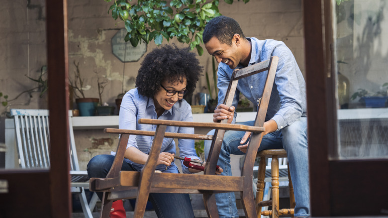 couple repair wood furniture