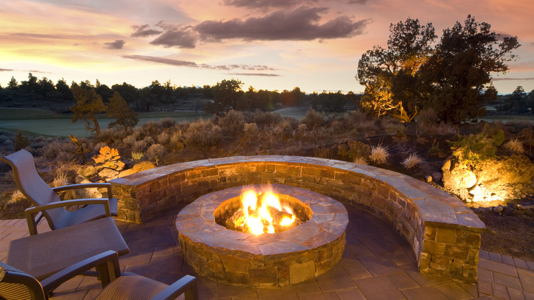 lit fire pit at dusk