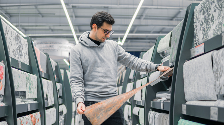 man shopping for wallpaper