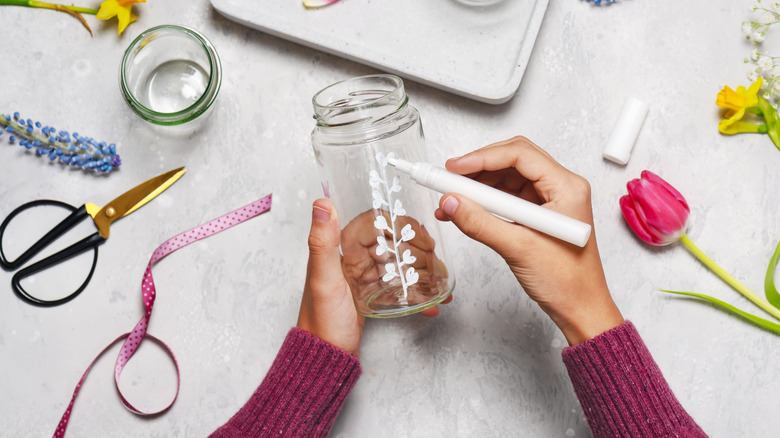 Someone DIY crafting with a jar