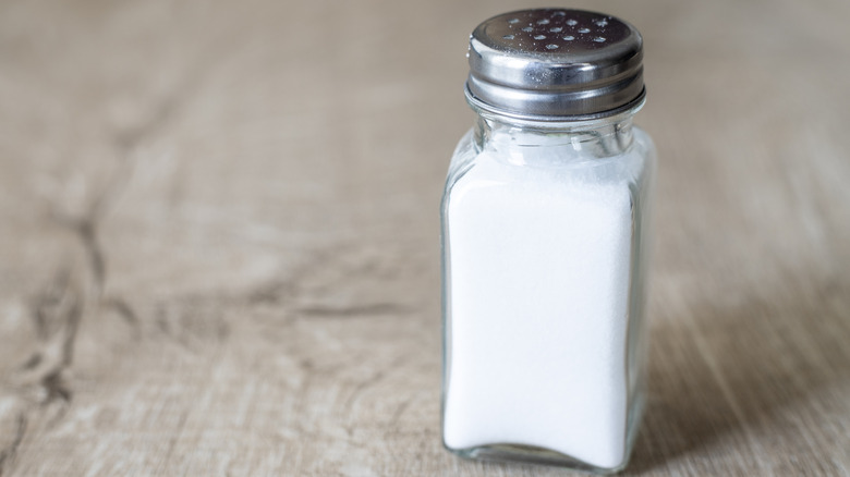 Salt shaker sitting on a table