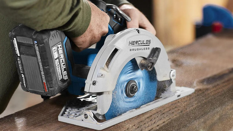 A man cutting lumber with the Hercules 20V cordless circular saw from Harbor Freight