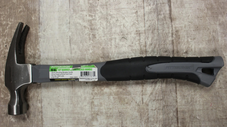 PITTSBURGH 16 OZ. Fiberglass Rip Hammer on wood table