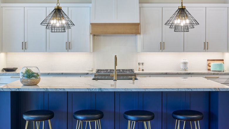 quartzite countertop with blue cabinets