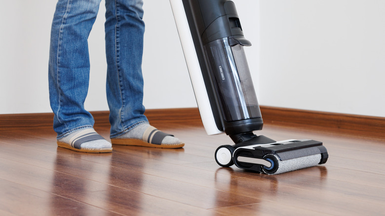 Person using vacuum mop 