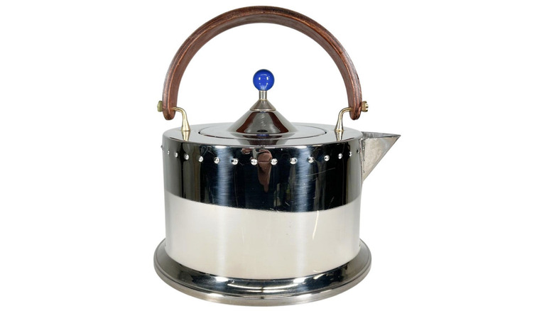 A vintage steel stovetop tea kettle.