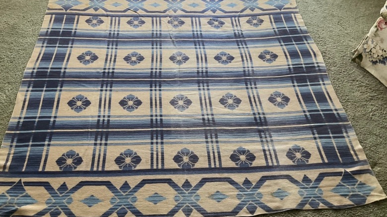 A plaid Beacon camp blanket with a blue pattern