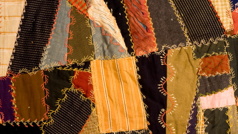 Patchwork crazy quilt with hand-stitched edges