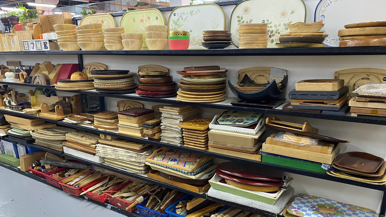 shelves of kitchenware at thrift shop