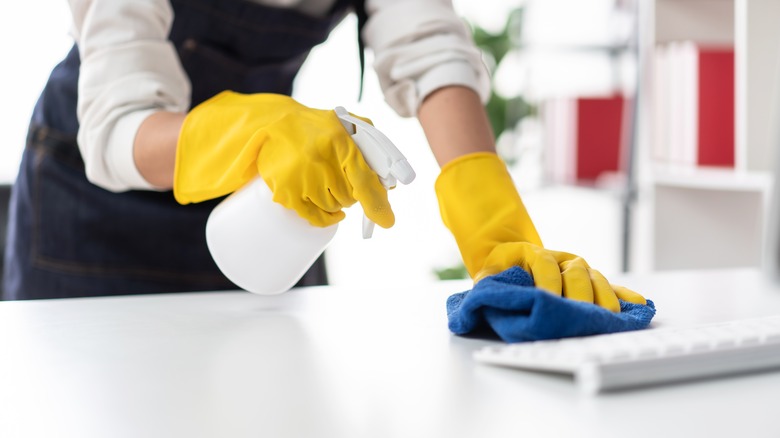 Hands cleaning countertop