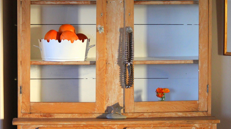 Antique rustic timber pie safe with decorative items