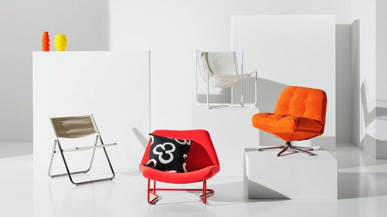 a selection of chairs from IKEA's Nytillverkad retro furniture line in a white room