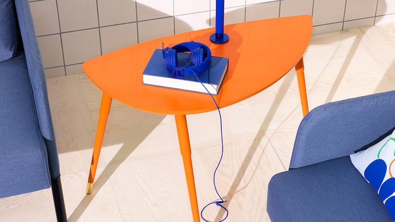 Bright orange coffee table with blue decor