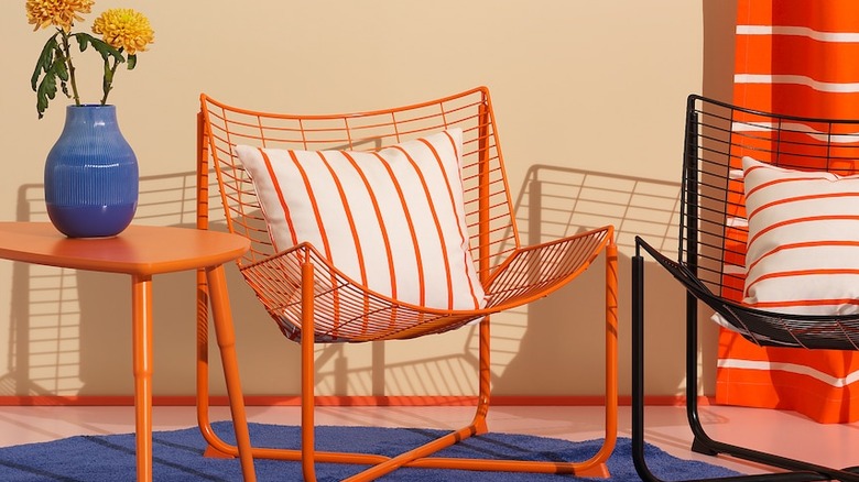 Modernist wire armchairs and side table