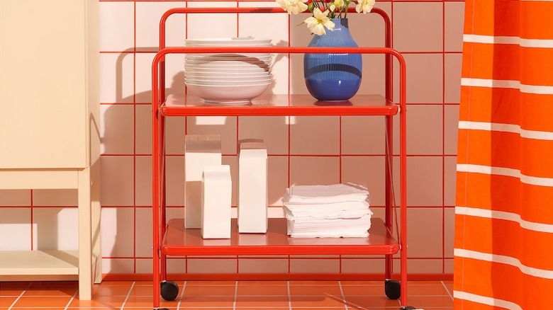 Bright red cart with checkered tile