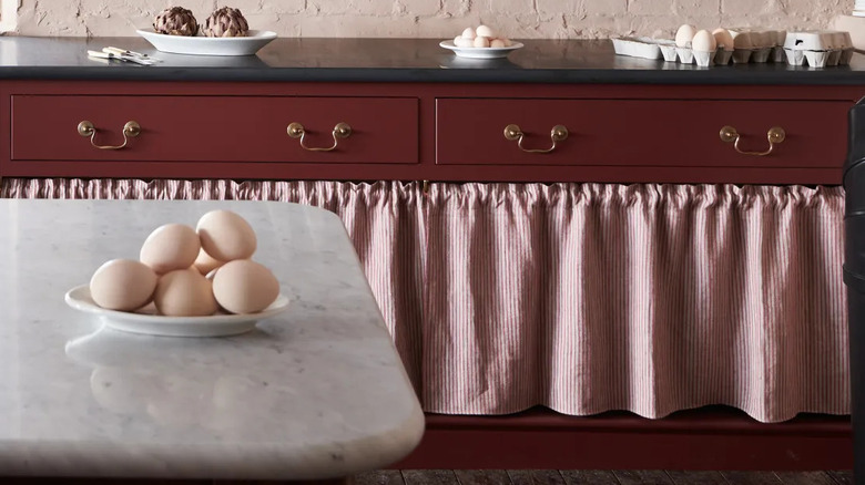 A vintage buffet with rustic details.