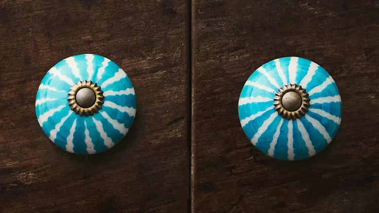 Blue and white painted ceramic pulls.
