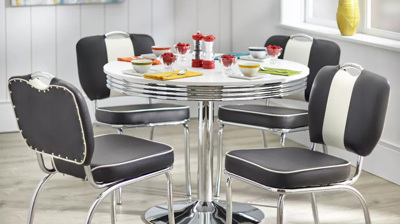 A retro table and chairs set with colorful accessories