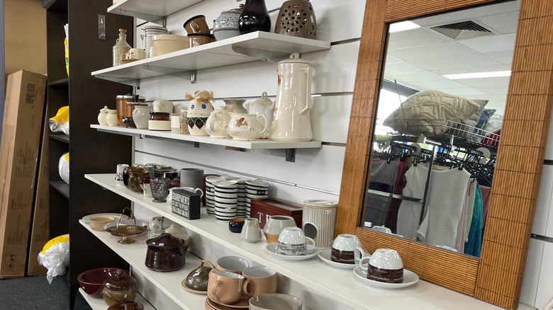 Vintage dishware on shelves in store