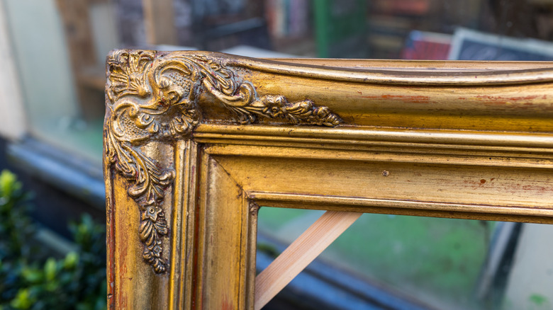 Corner of an ornate, antique frame