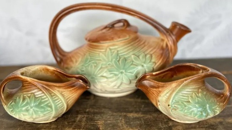 Three pieces of McCoy pottery with flowers