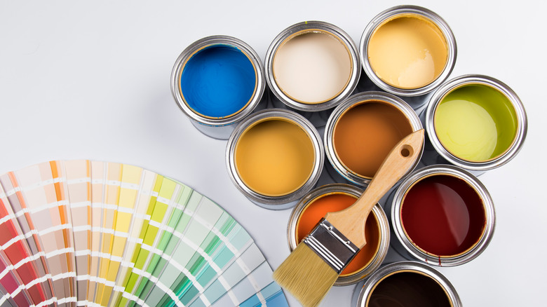 Cans of paint, multi-colored paint