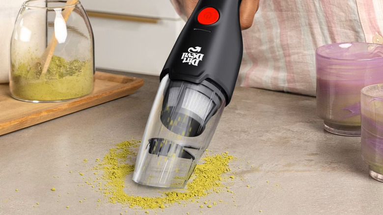Dirt Devil vacuuming up matcha on the counter